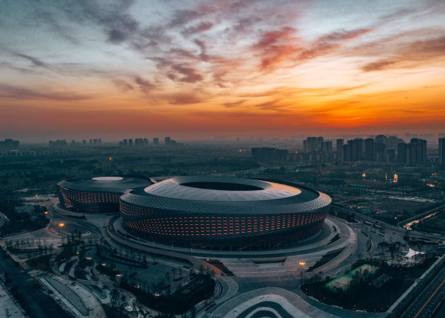 A round shaped building at dusk.