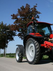 Kverneland Miniair Nova transported on road by tractor