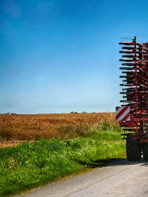 Kverneland U-drill, transported on road by tractor