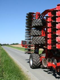 Kverneland U-drill, transported on road by tractor