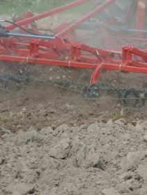 Seedbed Cultivators - Kverneland TLF performs precise depth control during operation on field