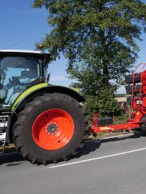 Kverneland U-drill, transported on road by tractor