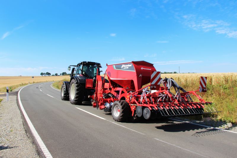 Kverneland U-drill, transported on road by tractor