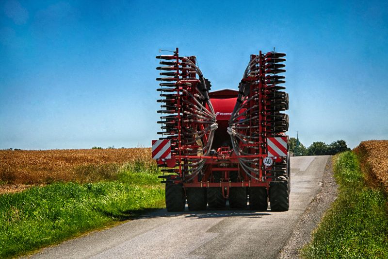 Kverneland U-drill, transported on road by tractor