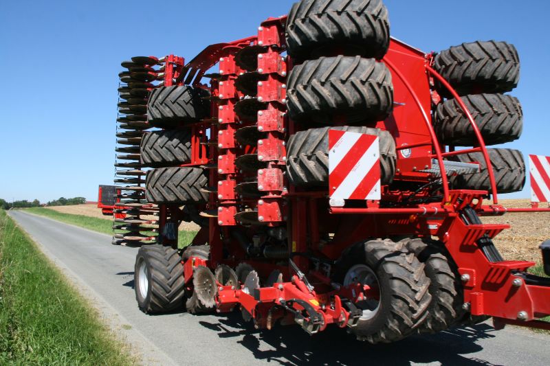 Kverneland U-drill, transported on road by tractor