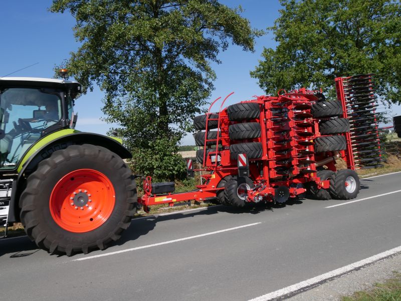 Kverneland U-drill, transported on road by tractor
