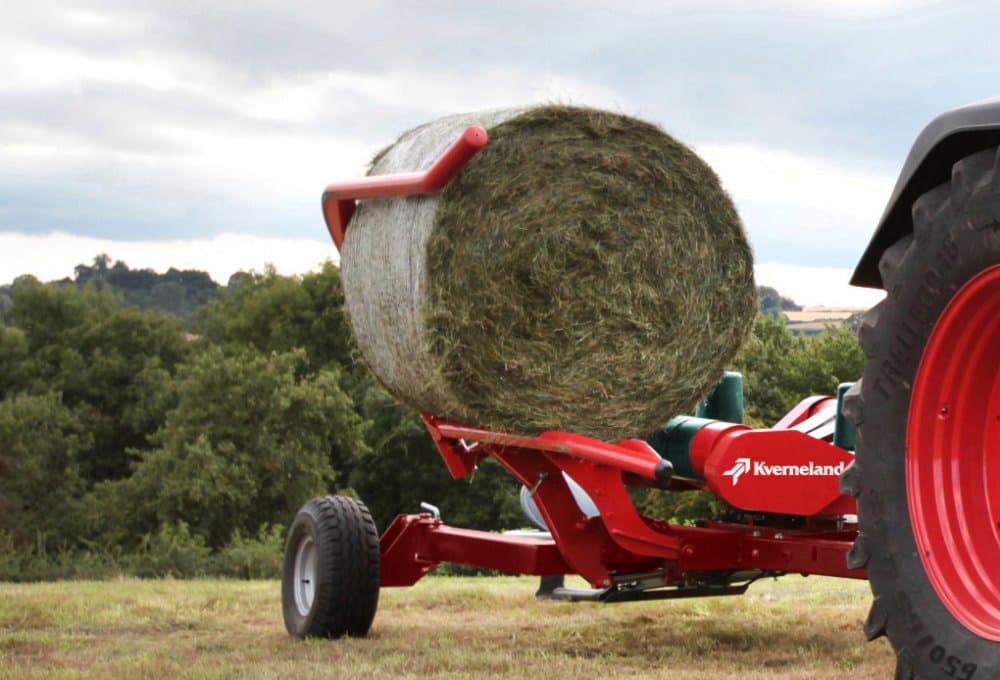 Round Bale Wrappers - Kverneland 7730, producing bales efficiently operating on field