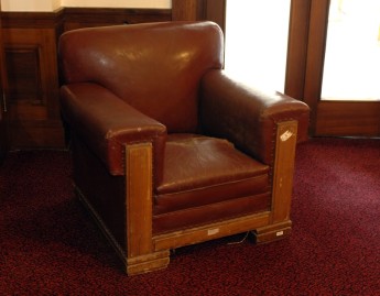 One of the Senate Club Room chairs before undergoing conservation treatment.