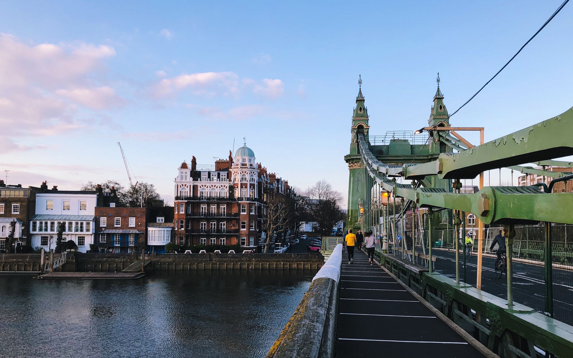 Walkway on Hammersmith Bridge with painted lines and walkers