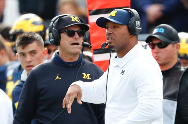 Michigan Wolverines football coach Jim Harbaugh (left) and OC Josh Gattis