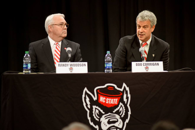 NC State chancellor Randy Woodson sits with new NC State director of athletics Boo Corrigan.