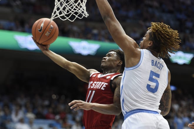 NC State Wolfpack guard Markell Johnson drives against UNC.