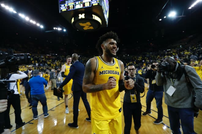 Michigan Wolverines basketball junior forward Isaiah Livers smiling.
