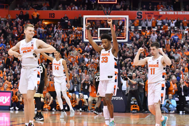 Syracuse redshirt junior wing Elijah Hughes, middle, leads the way at 19.4 points per game.