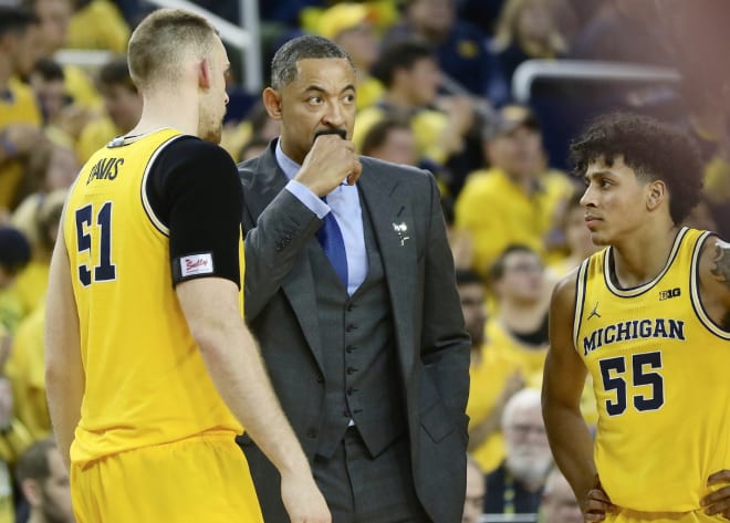 Michigan Wolverines basketball's Austin Davis, Juwan Howard and Eli Brooks during the MSU game.