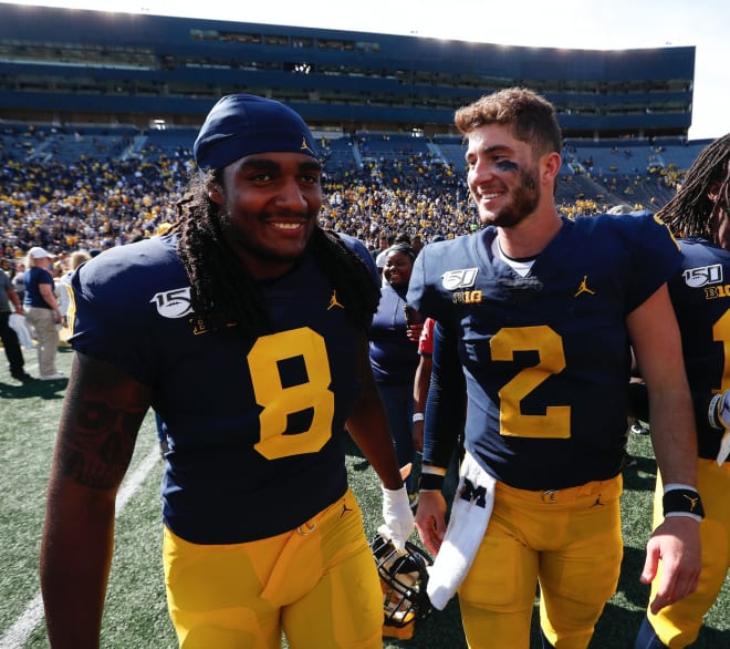 Michigan Wolverines football's Devin Gil (left) and Shea Patterson