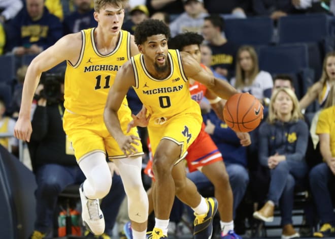 Former Michigan Wolverines basketball players Colin Castleton (left) and David DeJulius