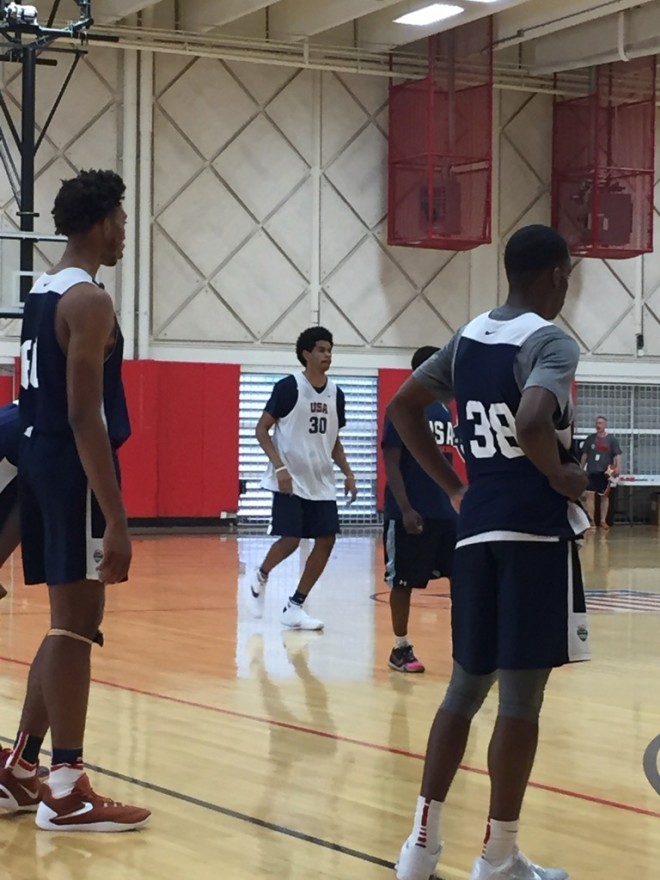 James Banks and Matt Coleman, two of the most talkative players, watch a scrimmage at USA Basketball.