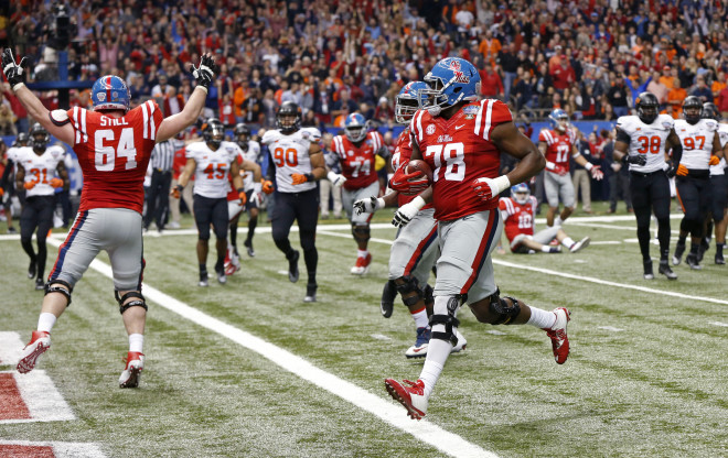 Ole Miss offensive lineman Laremy Tunsil (78) carries for a touchdown in the first half of the Sugar Bowl college football game against Oklahoma State in New Orleans, Friday, Jan. 1, 2016.