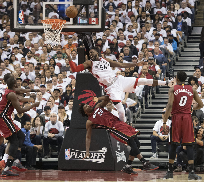 Toronto's Patrick Patterson shoots over Miami's Justice Winslow Sunday in Game 7 of the Eastern Conference semifinals. Patterson and the Raptors won, earning a matchup with Cleveland in the Eastern Conference finals starting this week in Ohio.