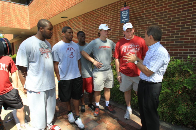 Saban speaks with Alabama players following the tornado outbreak on April 27, 2011.