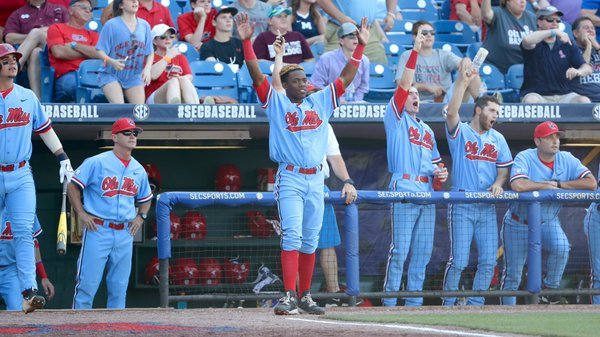 The Rebels react to a solo home run by JB Woodman. 