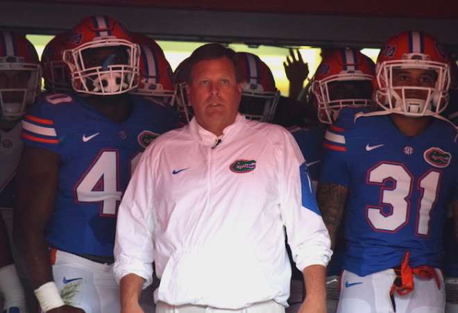 Florida head coach Jim McElwain leads his team out of the tunnel