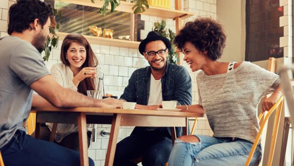 friends laughing and having a good time at a restaurant