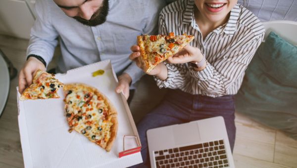 pizza, couple eating pizza, pizza box, laptop, couch