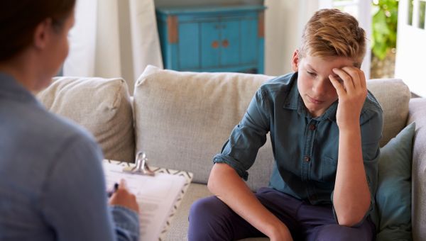 mother, son, stressed kid, boy on couch, living room, talking