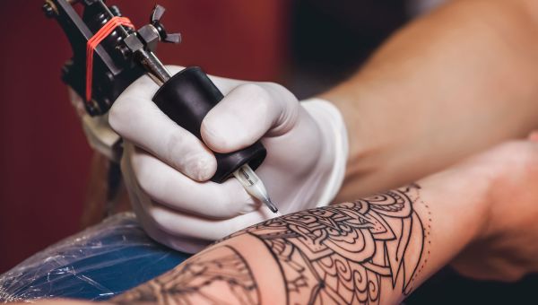 tattoo, arm, tattooing needle, getting a tattoo