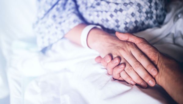 holding hands, hospital gown, medical bracelet