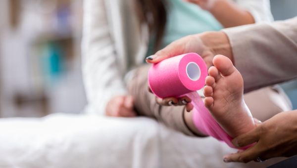 pink bandage, foot, ankle, bedroom