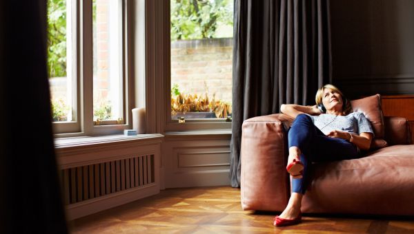 woman sitting in a chair by the window