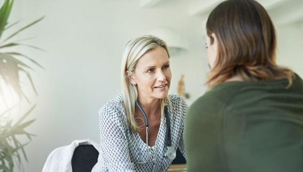 someone talking with their healthcare provider