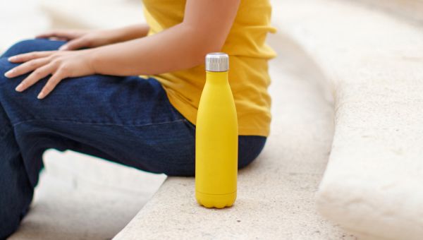 Person holding water bottle