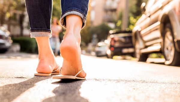 woman walking in flip flops