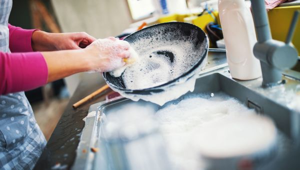 Woman washing dishes