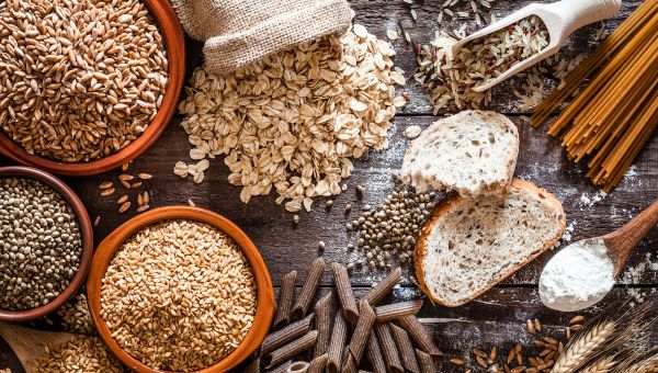 Various grains and nuts on a wooden table