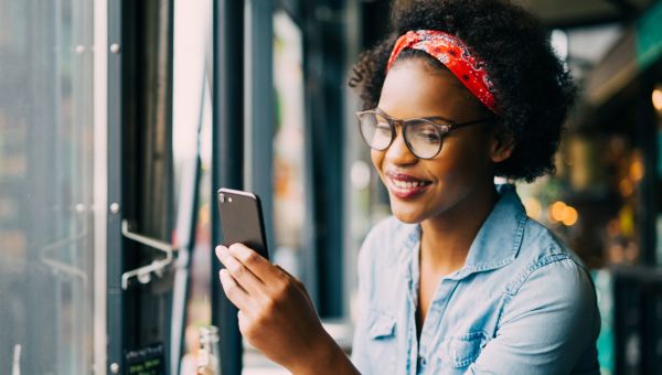 Woman logging her calories into app on her phone