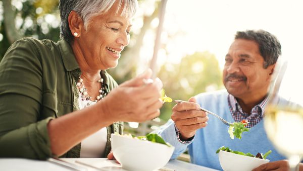 older couple eating dinner together