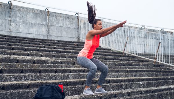 Woman doing jump squats