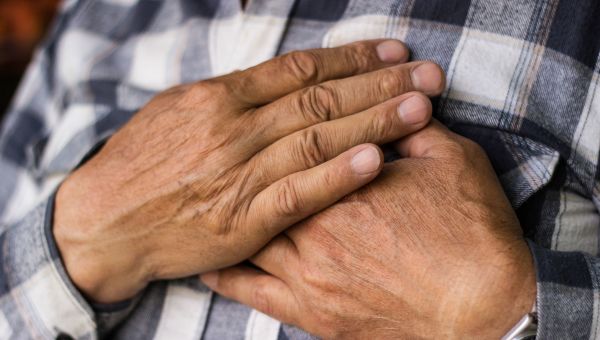 Senior man experiencing chest pain