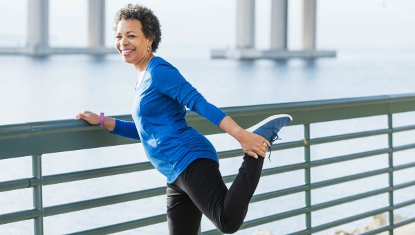 Woman stretching her legs before a run