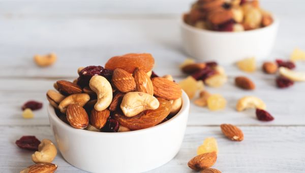 White bowls of mixed nuts