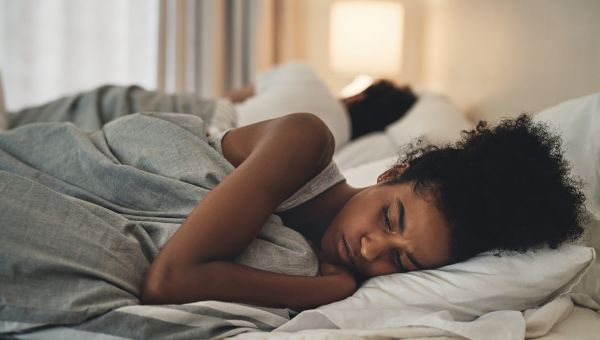 unhappy couple in bed