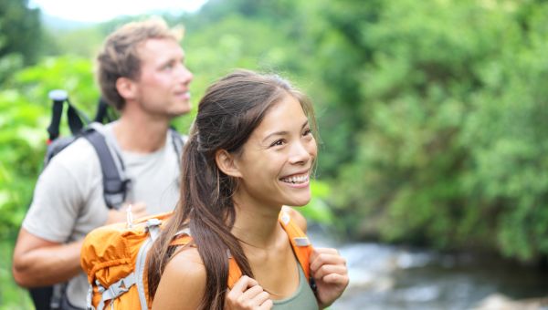 Woman and man hiking in summer