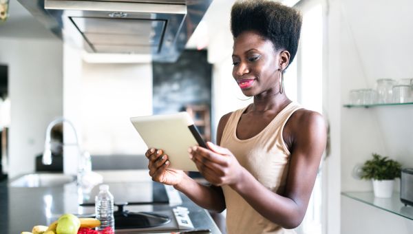 young woman reading tablet