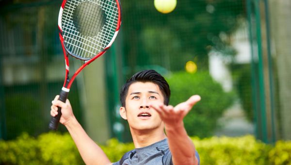 young man playing tennis