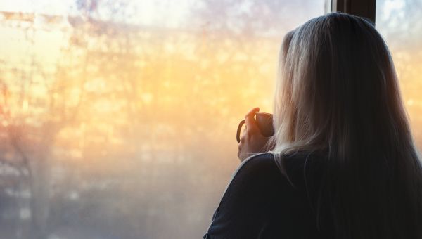 mature woman sipping tea